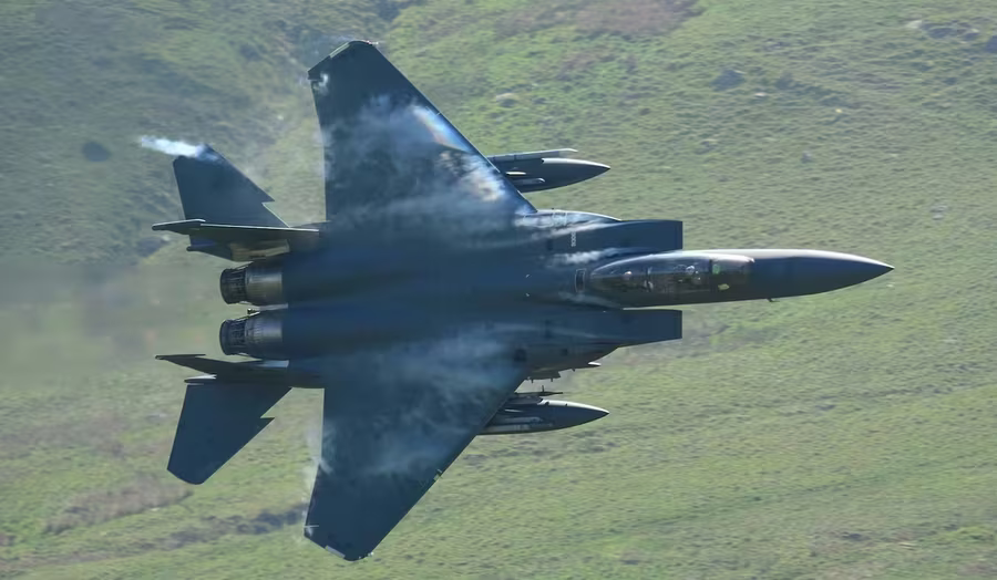 RAF fighter jet low-level flying through the Mach Loop valley near Tywyn, Wales